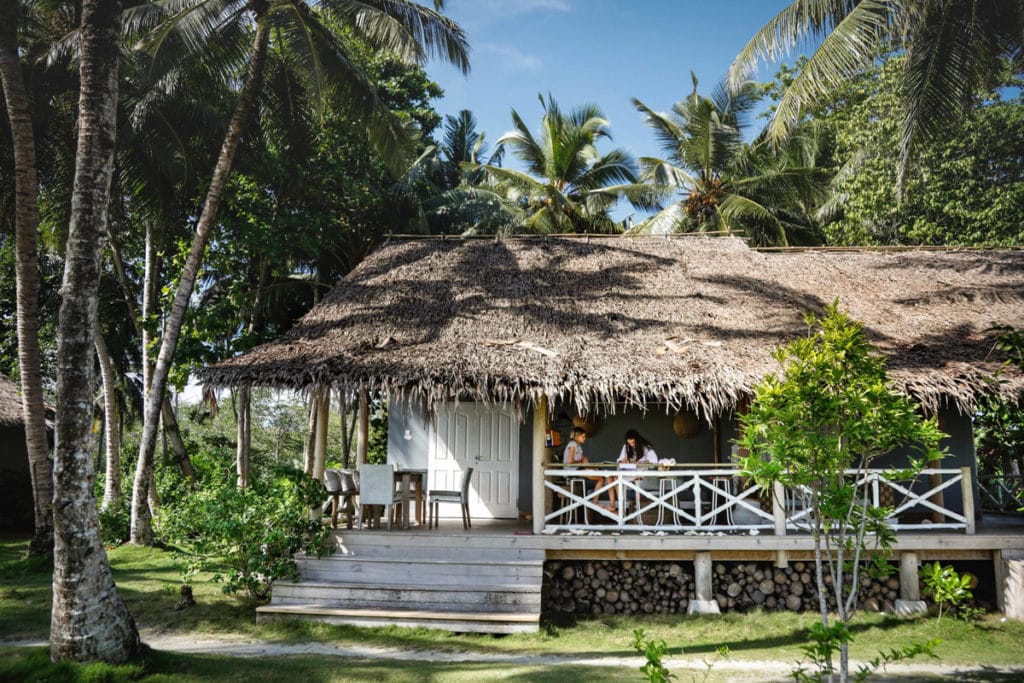 Family Sitting on Bungalow at Mentawai Family Resort - Mentawais Indonesia